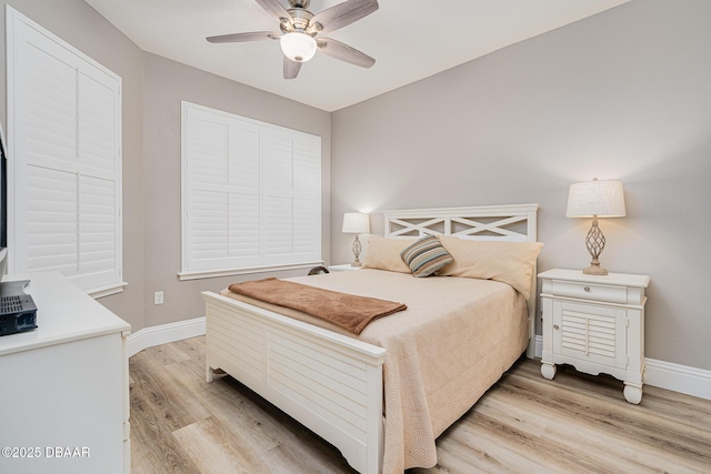 bedroom featuring light hardwood / wood-style floors and ceiling fan