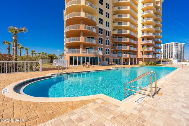 view of pool featuring a patio