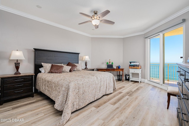 bedroom featuring a water view, crown molding, light hardwood / wood-style floors, and access to outside