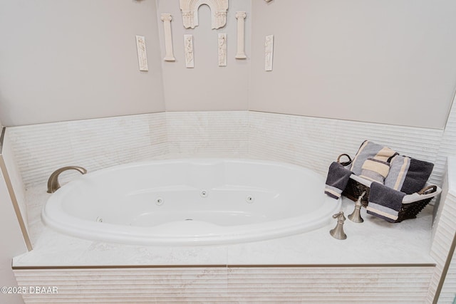 bathroom featuring tiled tub