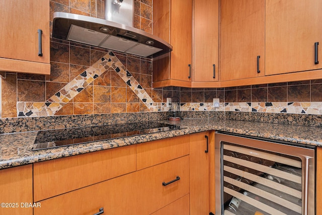 kitchen featuring ventilation hood, dark stone countertops, black electric cooktop, beverage cooler, and decorative backsplash