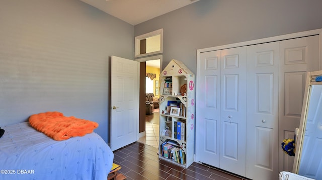 bedroom featuring a closet and wood tiled floor