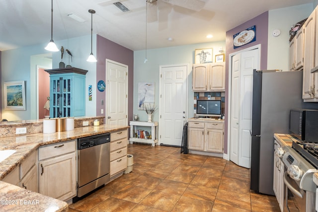 kitchen with light stone counters, ceiling fan, pendant lighting, appliances with stainless steel finishes, and light brown cabinetry