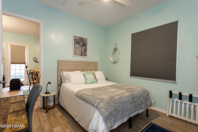 bedroom featuring hardwood / wood-style flooring and ceiling fan