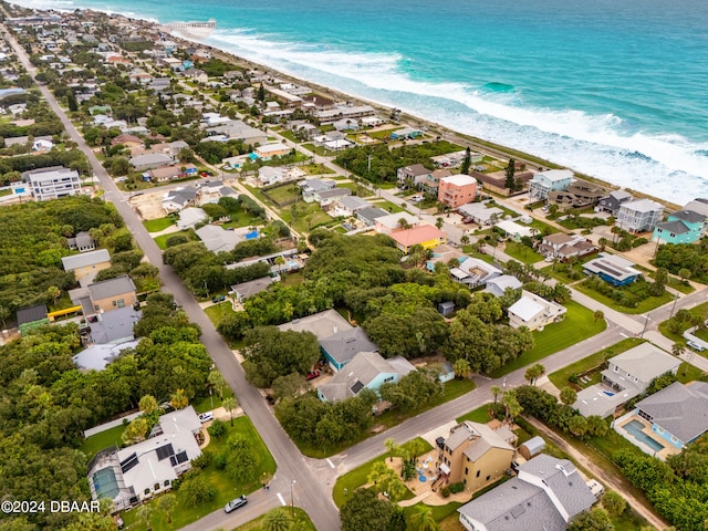 aerial view featuring a view of the beach and a water view