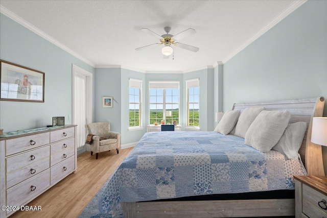 bedroom with ceiling fan, a textured ceiling, light hardwood / wood-style floors, and crown molding