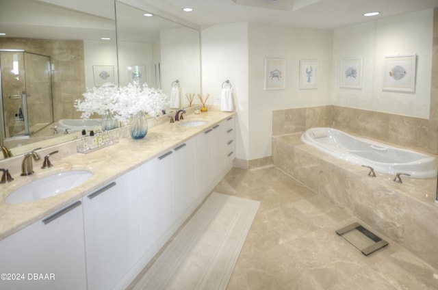 bathroom with vanity and separate shower and tub