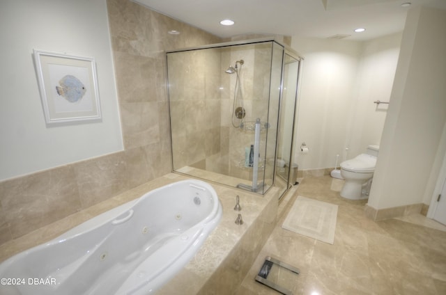 bathroom with tile patterned floors, toilet, and shower with separate bathtub