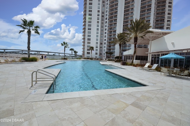 view of pool featuring a patio