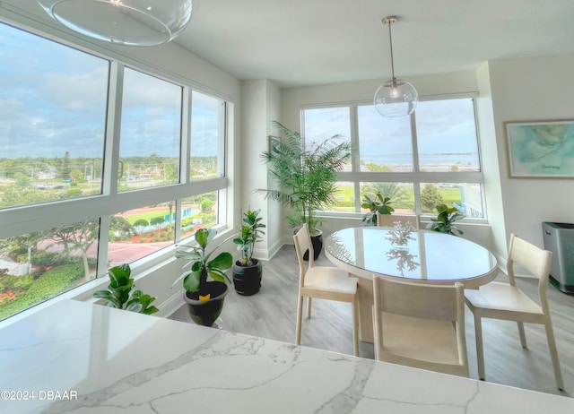 sunroom / solarium featuring plenty of natural light