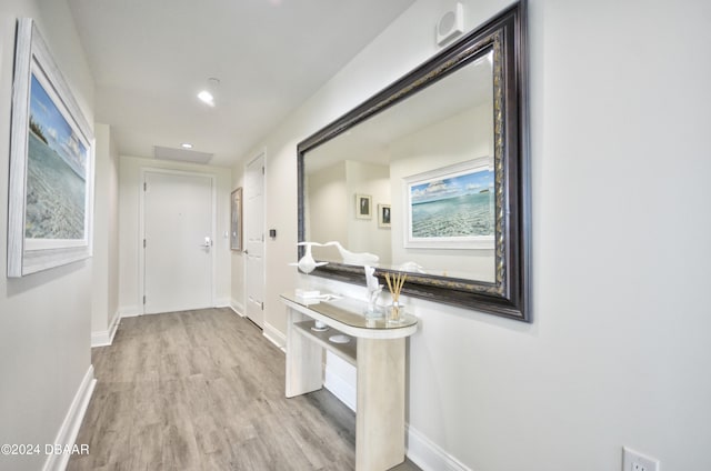 corridor featuring light hardwood / wood-style flooring