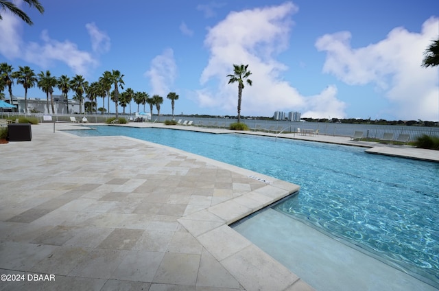 view of swimming pool featuring a patio