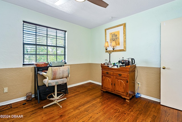 office space with a textured ceiling, dark hardwood / wood-style flooring, and ceiling fan