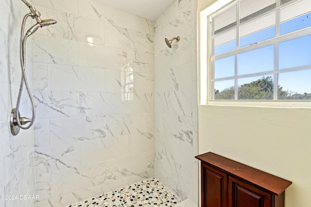 bathroom with a tile shower