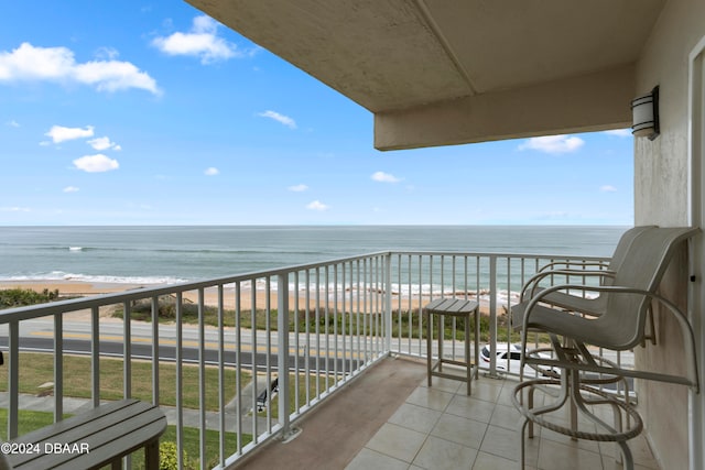 balcony with a beach view and a water view