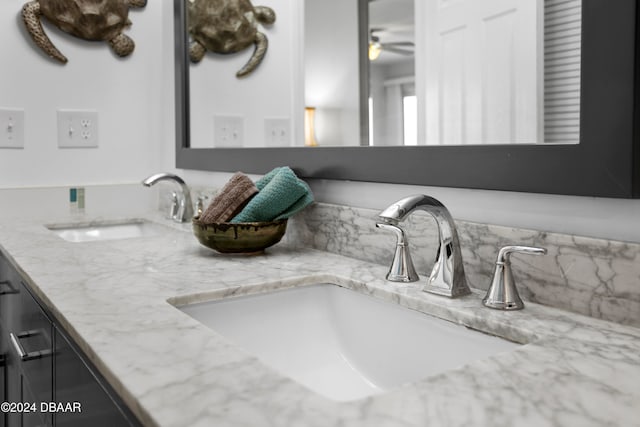 bathroom featuring ceiling fan and vanity