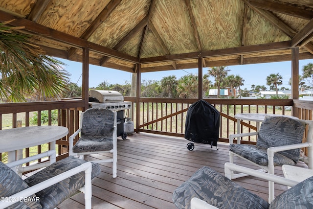 wooden terrace with a gazebo and grilling area