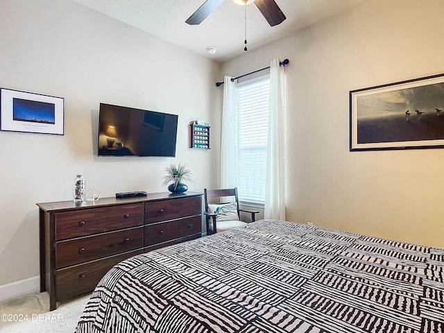 645 Elk River Dr, Ormond Beach, FL 32174 - bedroom with light colored carpet, a ceiling fan, and baseboards
