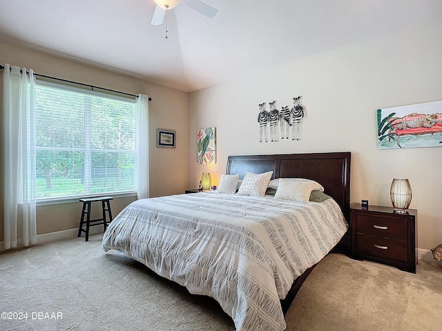645 Elk River Dr, Ormond Beach, FL 32174 - carpeted bedroom with baseboards, a textured ceiling, and a ceiling fan