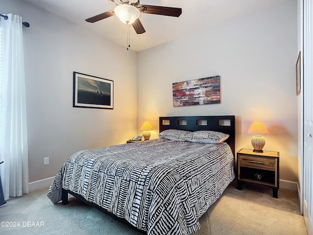 645 Elk River Dr, Ormond Beach, FL 32174 - bedroom with baseboards, ceiling fan, and carpet flooring