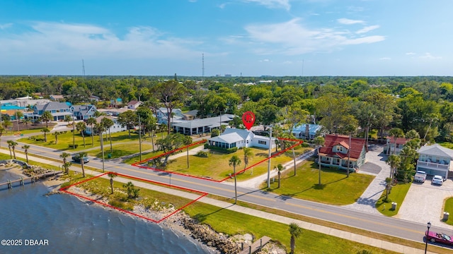 drone / aerial view featuring a water view and a residential view