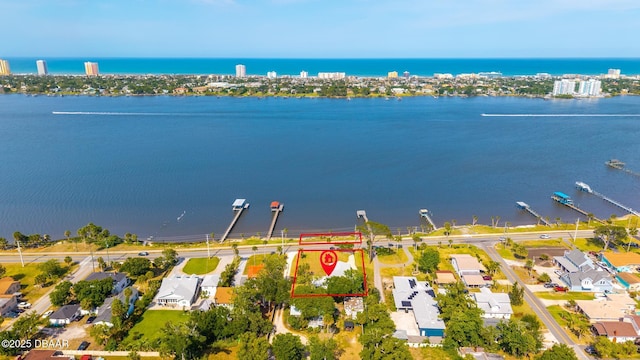 bird's eye view featuring a residential view and a water view