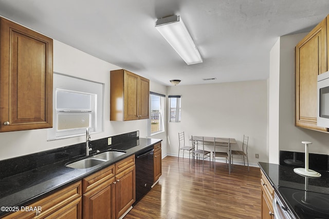kitchen featuring a sink, brown cabinets, dishwasher, electric range, and dark wood finished floors