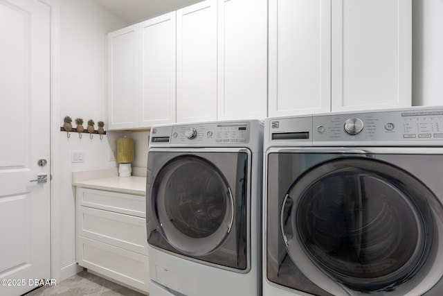 613 Good Life Way, Daytona Beach, FL 32124 - laundry area with washing machine and clothes dryer and cabinet space