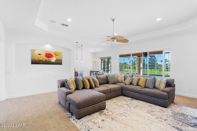 tiled living room featuring ceiling fan