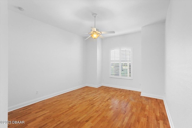 unfurnished room featuring ceiling fan and light wood-type flooring