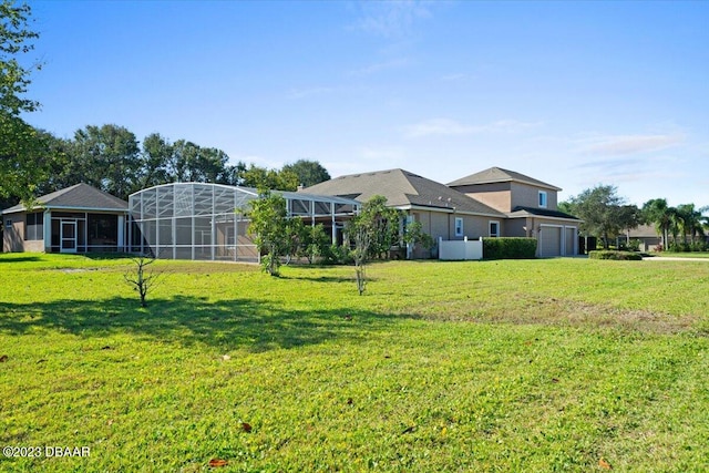 view of yard with glass enclosure