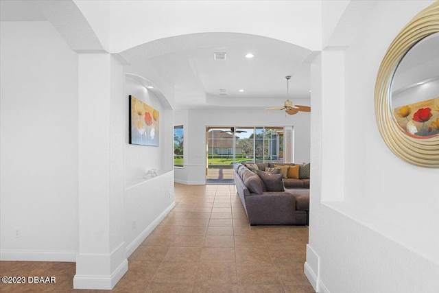 corridor featuring light tile patterned floors