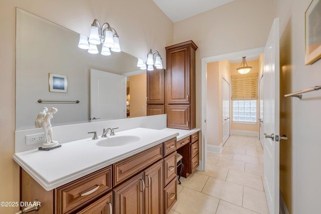 bathroom featuring baseboards, vanity, and tile patterned floors