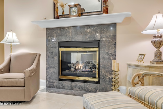 interior details with a fireplace and baseboards