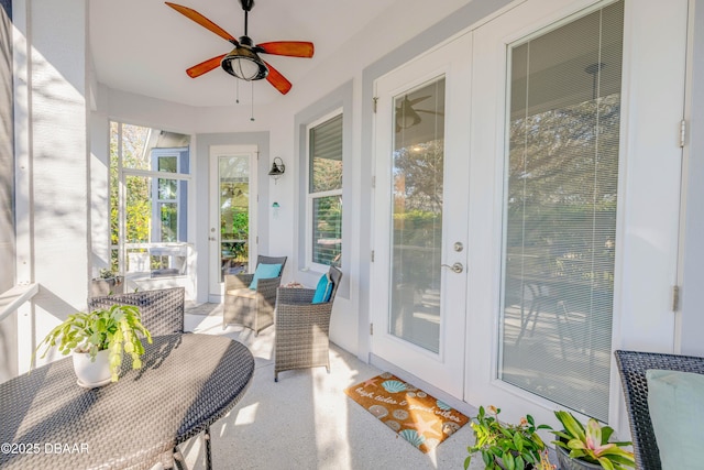 sunroom with ceiling fan and french doors