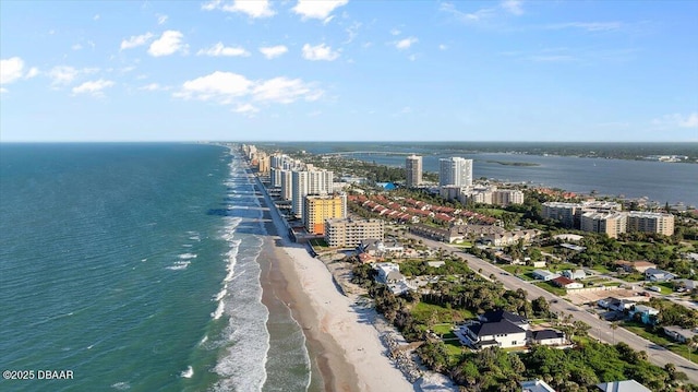 aerial view with a water view and a beach view