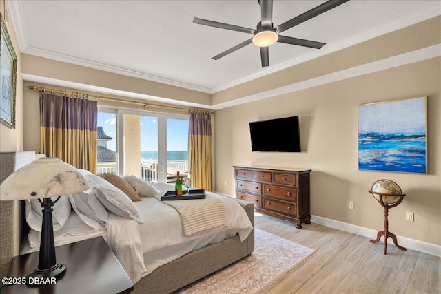 bedroom featuring ceiling fan, light wood-type flooring, and ornamental molding