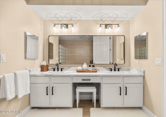 bathroom featuring hardwood / wood-style floors and vanity