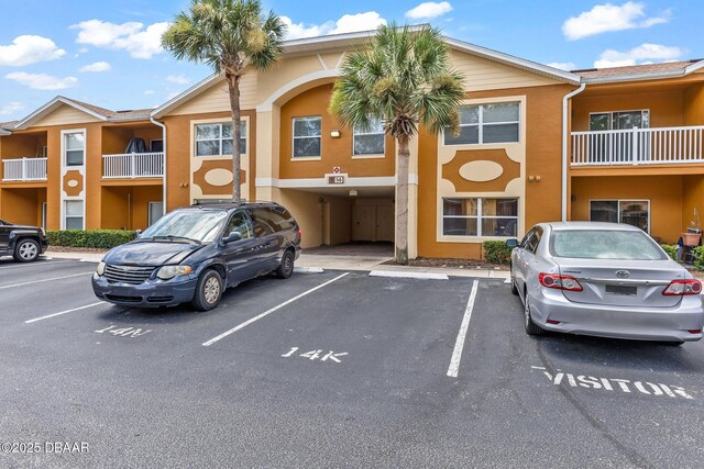 4600 E Moody Blvd Unit 14-O, Bunnell, FL 32110 - view of building exterior with uncovered parking