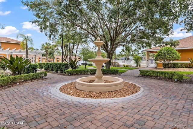 4600 E Moody Blvd Unit 14-O, Bunnell, FL 32110 - view of community with a pergola and curved driveway