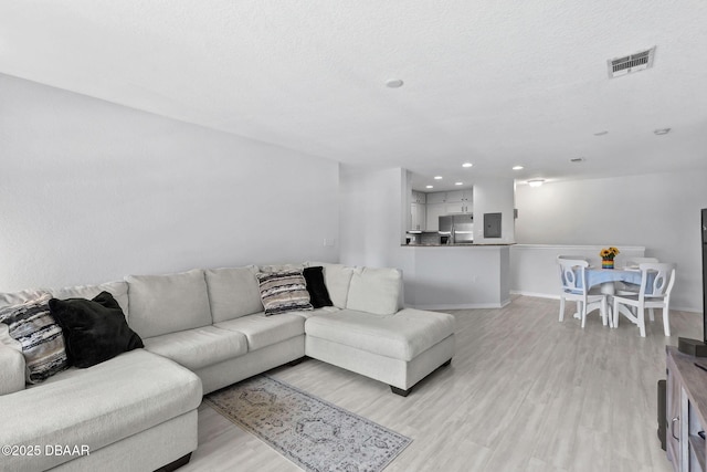 4600 E Moody Blvd Unit 14-O, Bunnell, FL 32110 - living room with light wood-style floors and recessed lighting