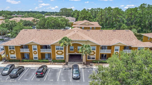 4600 E Moody Blvd Unit 14-O, Bunnell, FL 32110 - view of building exterior with uncovered parking