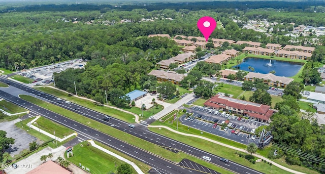 4600 E Moody Blvd Unit 14-O, Bunnell, FL 32110 - aerial overview of property's location featuring a forest and a nearby body of water