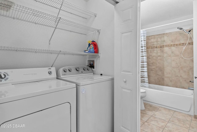 4600 E Moody Blvd Unit 14-O, Bunnell, FL 32110 - laundry area featuring washing machine and dryer and light tile patterned floors