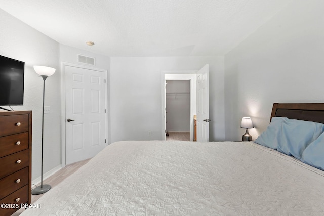 4600 E Moody Blvd Unit 14-O, Bunnell, FL 32110 - bedroom featuring a spacious closet and light wood-style floors