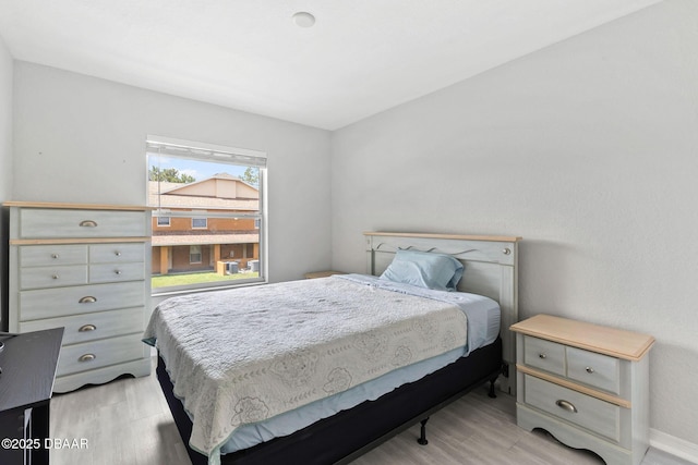 4600 E Moody Blvd Unit 14-O, Bunnell, FL 32110 - bedroom with light wood-type flooring and baseboards
