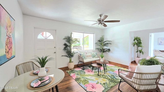119 Rogers Park Dr, Ormond Beach, FL 32174 - living room featuring baseboards, wood finished floors, and a ceiling fan