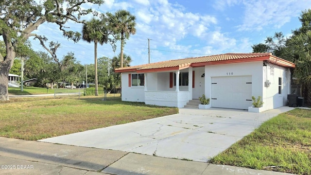 119 Rogers Park Dr, Ormond Beach, FL 32174 - single story home with an attached garage, stucco siding, a tiled roof, and concrete driveway