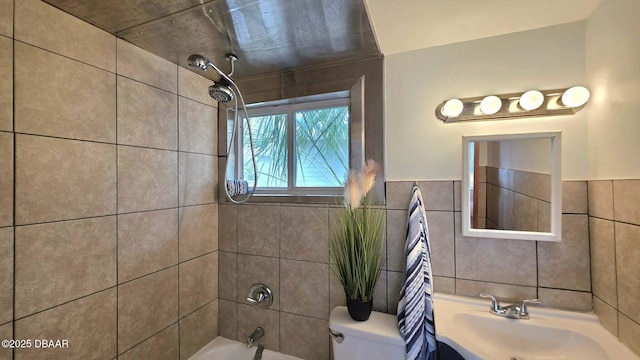 119 Rogers Park Dr, Ormond Beach, FL 32174 - bathroom with toilet, tile walls, shower / washtub combination, and a sink