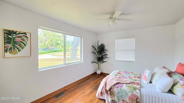 119 Rogers Park Dr, Ormond Beach, FL 32174 - bedroom with baseboards, wood finished floors, and ceiling fan